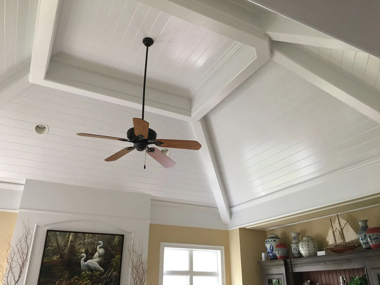 Vaulted beadboard ceiling with ceiling fan
