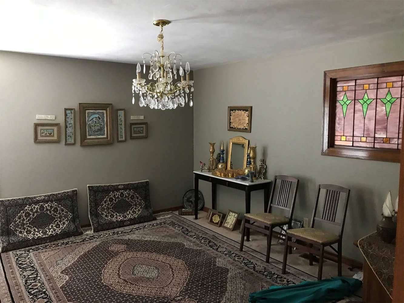 Room with painted walls and stained glass window