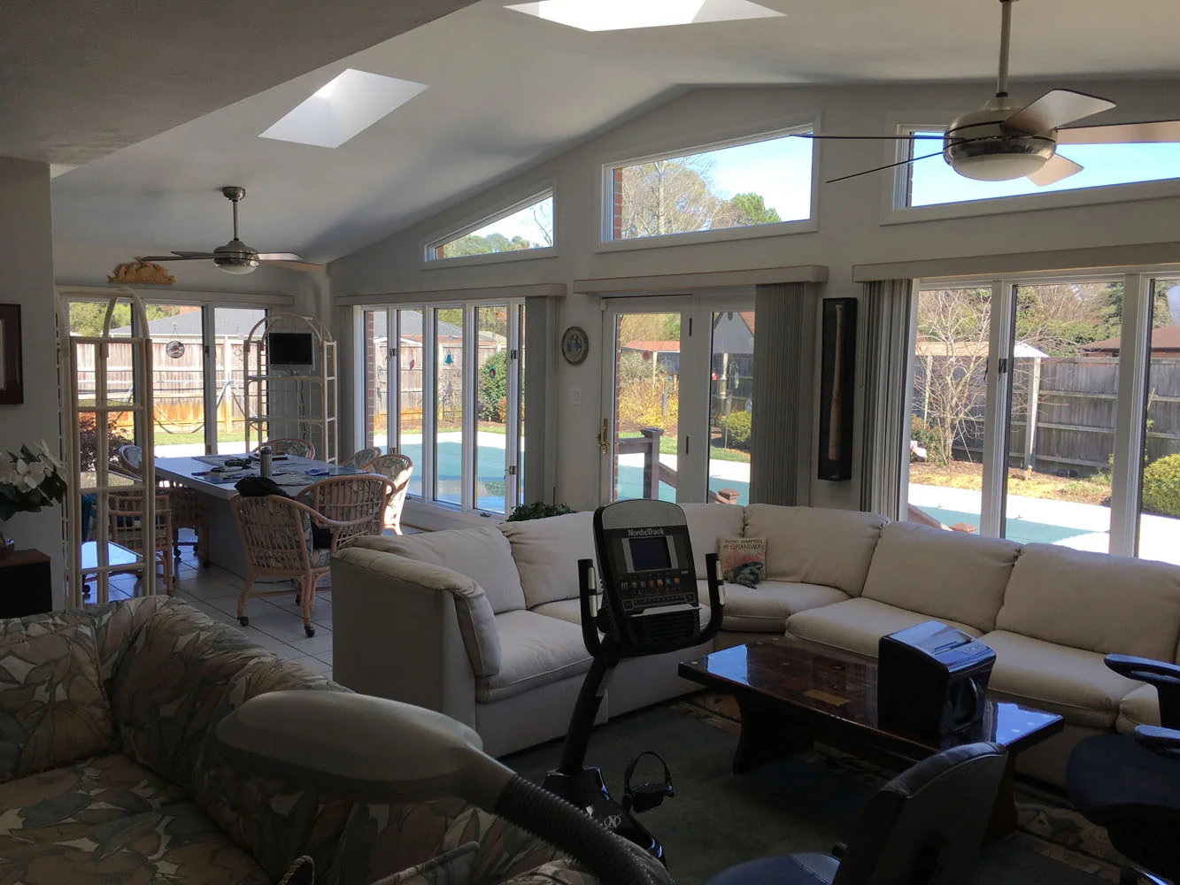 Bright sunroom with pool view