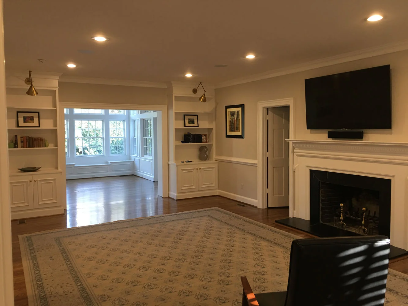 Living room with built-in shelves and fireplace