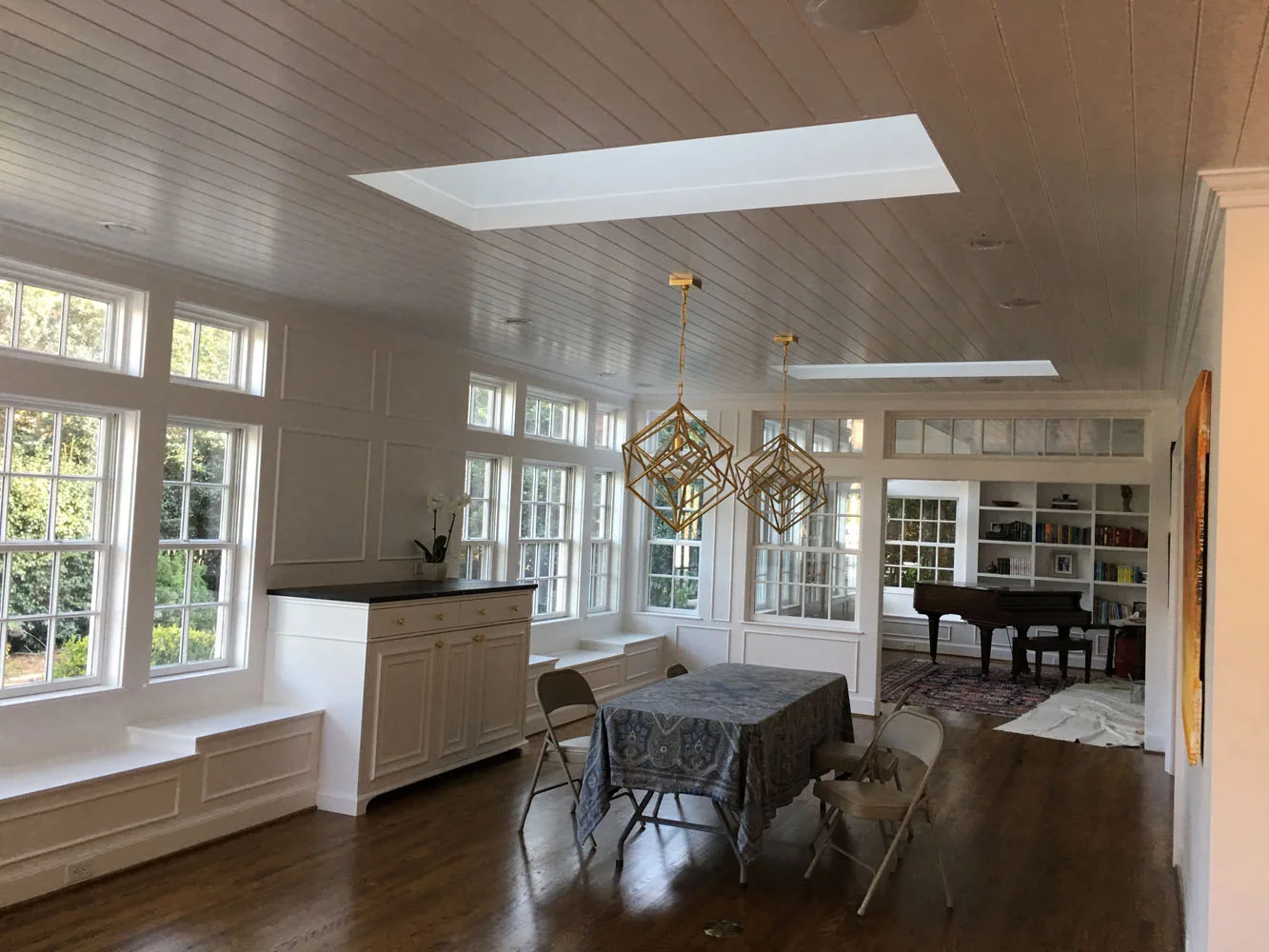 Bright dining area with gold pendant lights