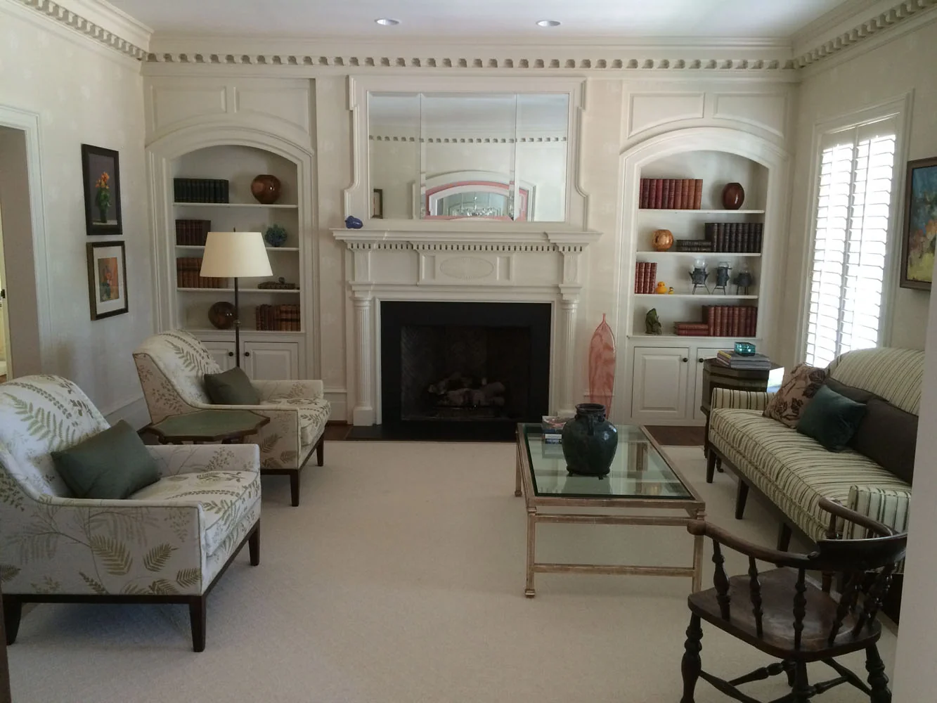 Elegant living room with fireplace and built-in bookshelves